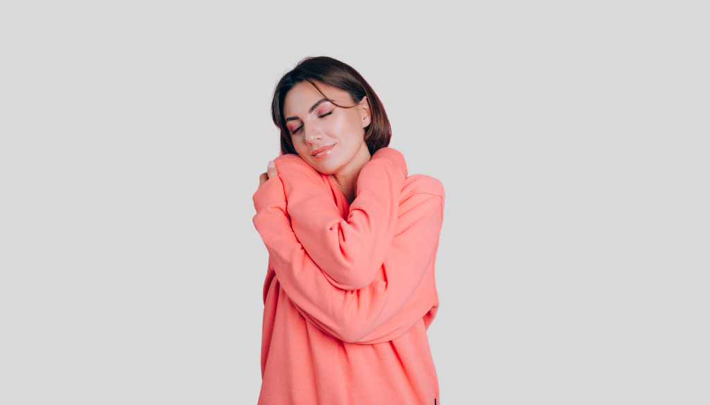 A woman feeling happy after being kind to herself