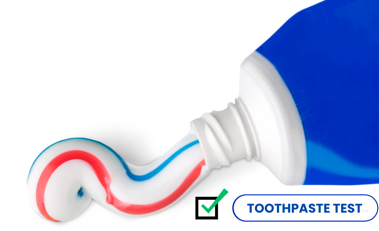 An image with a squeezed toothpaste and text "toothpaste test"